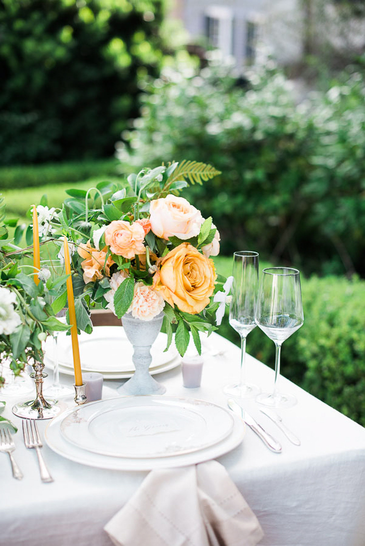 Outdoor table setting with yellow roses